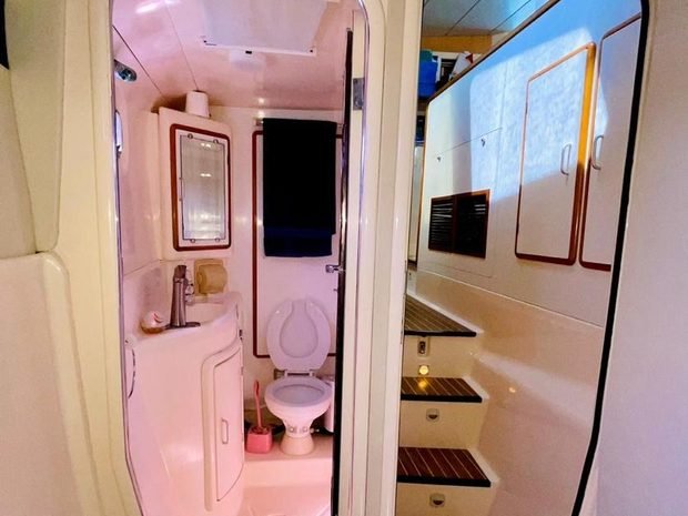 A cabin with a shower room off it