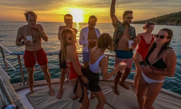 A group on the bow at sunset